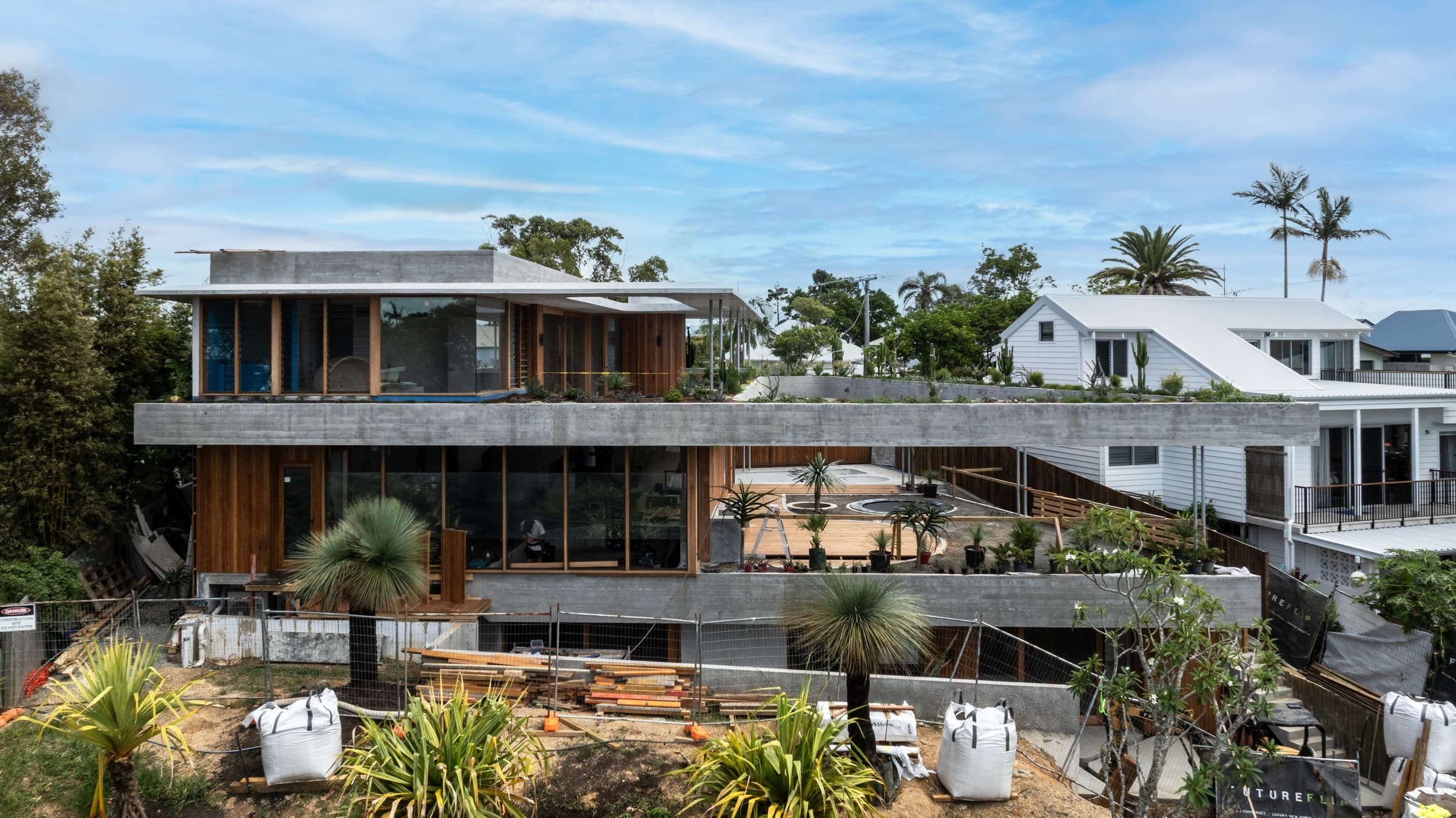 Paterson under construction, viewed from the rear lane: two levels of concrete and timber extending to the rear boundary