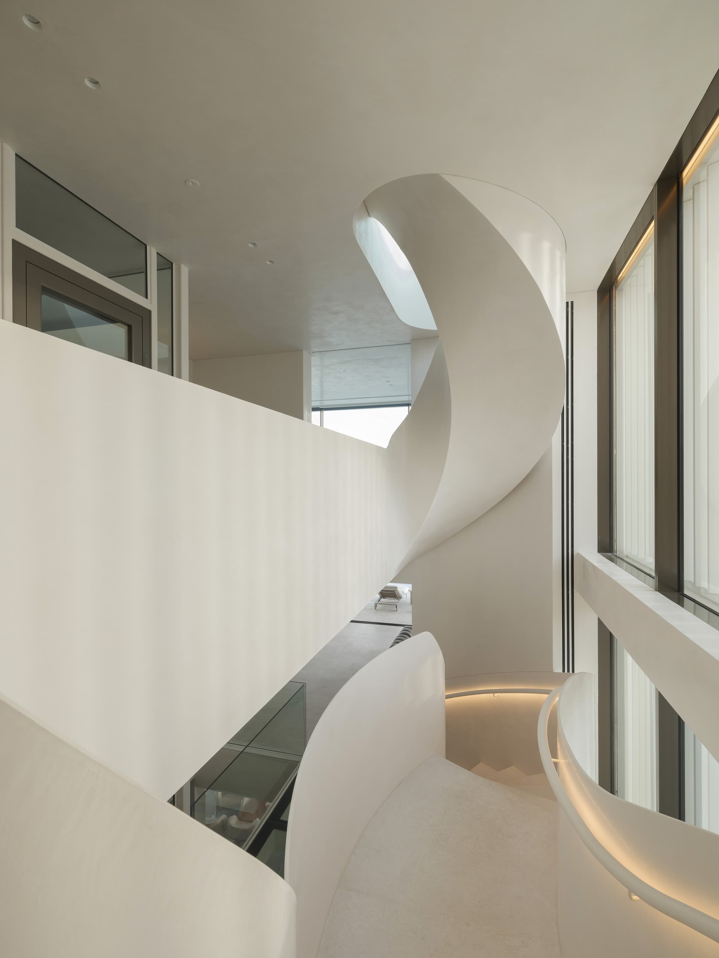Stafford's sculptural helical staircase beneath the glazed rooftop Skybox